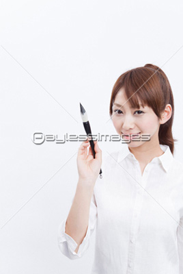 筆を持つ女性 ストックフォトの定額制ペイレスイメージズ