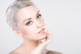 young beautiful caucasian woman with natural makeup posing in the studio