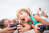 Brother and sister playing video games